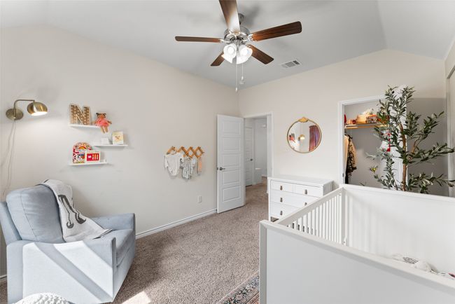 Bedroom with lofted ceiling, light carpet, and ceiling fan | Image 21