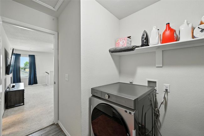 Washroom with hookup for a washing machine and wood finished floors | Image 23