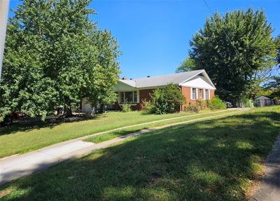 View of front of property featuring a storage unit and a front yard | Image 2