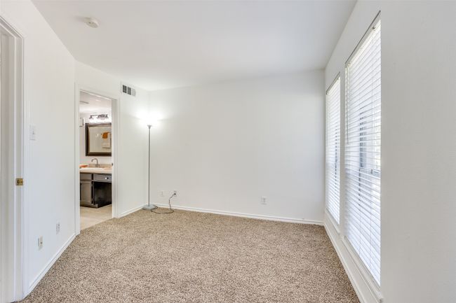 Second bedroom has two large windows, direct access to bathroom. | Image 12
