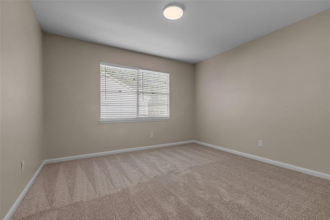 Upstairs bedroom at the front of the house with large walk-in closet. | Image 33
