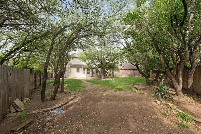View of fenced backyard | Image 17
