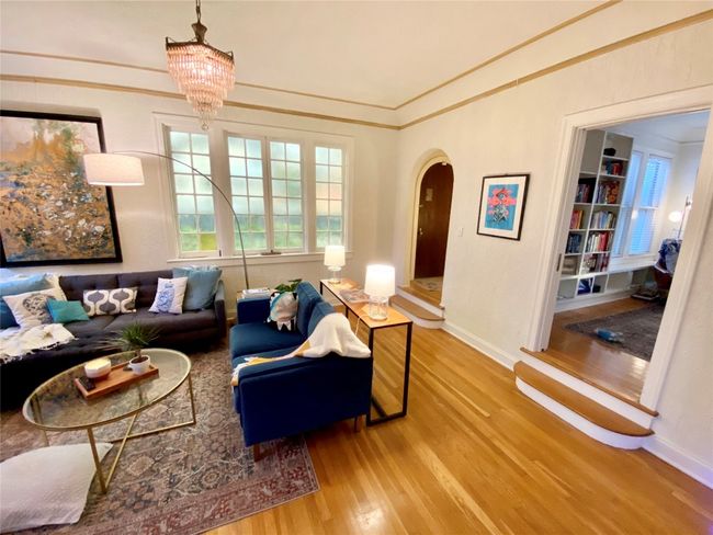 Living room with step up to the library/office. | Image 10