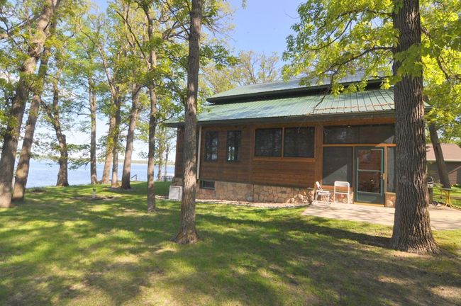 South side of home shows low maintenance steel roof. | Image 55