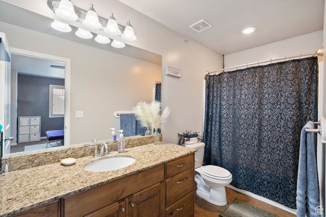Ensuite bathroom with vanity, tile patterned floors, and a shower with curtain | Image 18
