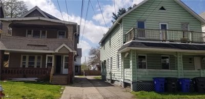 View of front facade with covered porch and a balcony | Image 1