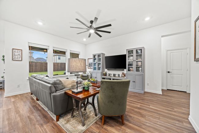Living room featuring ceiling fan, wood finished floors, recessed lighting, and baseboards | Image 7