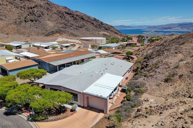 Aerial view of property and surrounding area featuring a mountainous background | Image 72