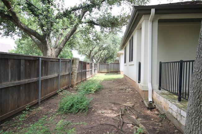 View of fenced backyard | Image 22