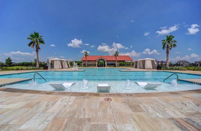 Enjoy sunny days and family gatherings by this inviting pool, perfect for relaxation and outdoor fun. | Image 23