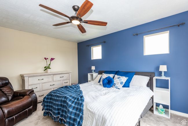 Carpeted bedroom featuring a ceiling fan | Image 17