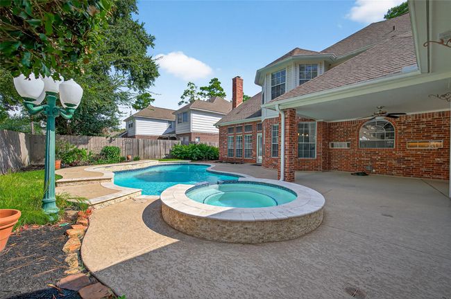 Pool and Spa with recent aesthetic upgrades including tile, coping and water features. | Image 42