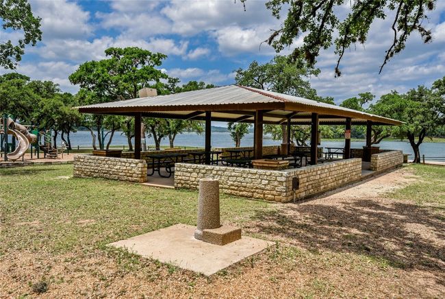 View of home's community featuring playground community, a gazebo, a yard, and a water view | Image 21