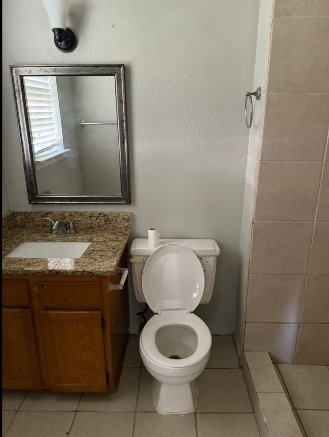 Full bathroom featuring vanity, tile patterned floors, and a shower | Image 24