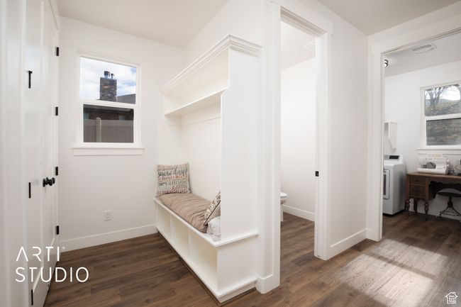 Mudroom featuring dark hardwood / wood-style floors and washer / dryer | Image 15