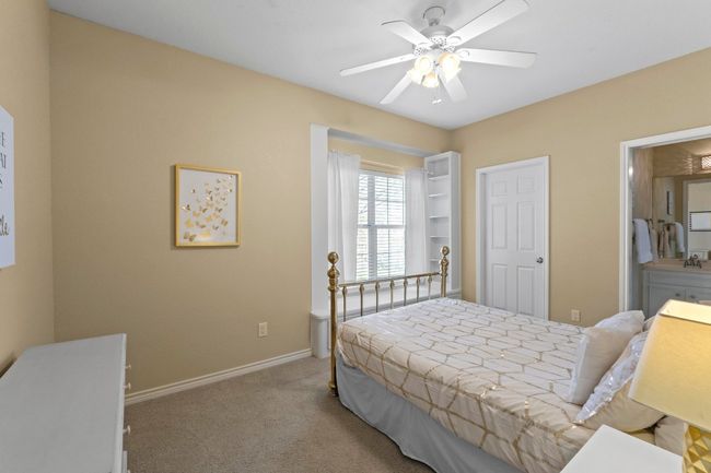 Carpeted bedroom with baseboards and ceiling fan | Image 28