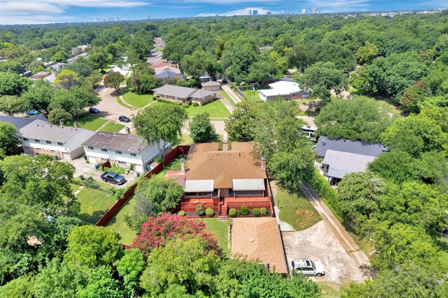 Aerial perspective of suburban area featuring a heavily wooded area | Image 38