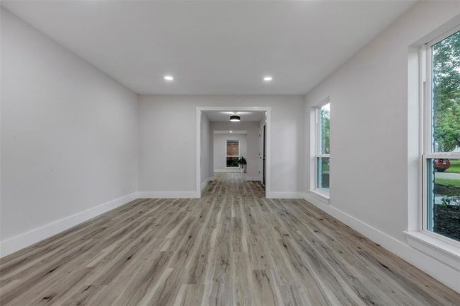 Expansive family room can be used as home office /study or a game room downstairs. | Image 23