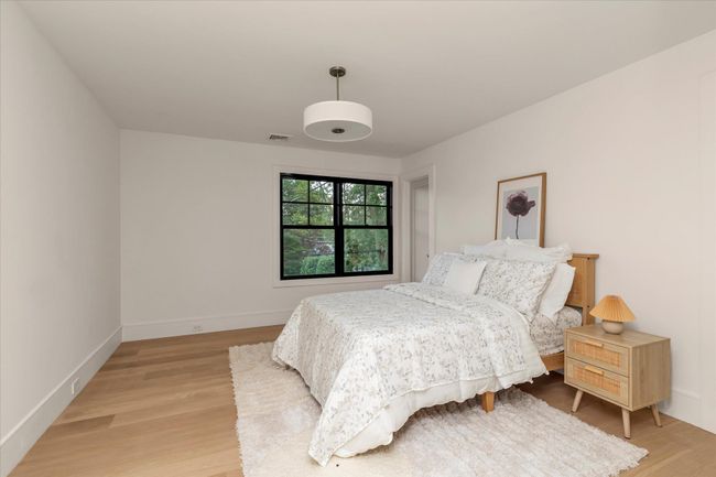 Bedroom featuring light wood-type flooring and baseboards | Image 11