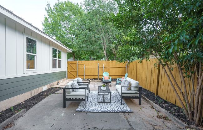 Fenced backyard with outdoor lounge area and a patio area | Image 29