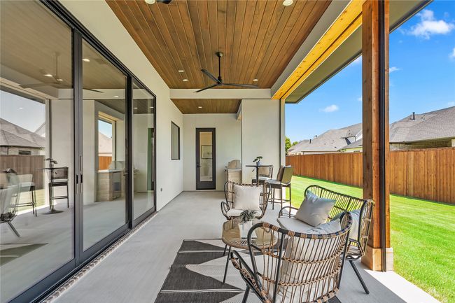 Fenced backyard with a ceiling fan | Image 38