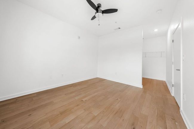 Spare room featuring visible vents, a ceiling fan, recessed lighting, light wood-style floors, and baseboards | Image 9