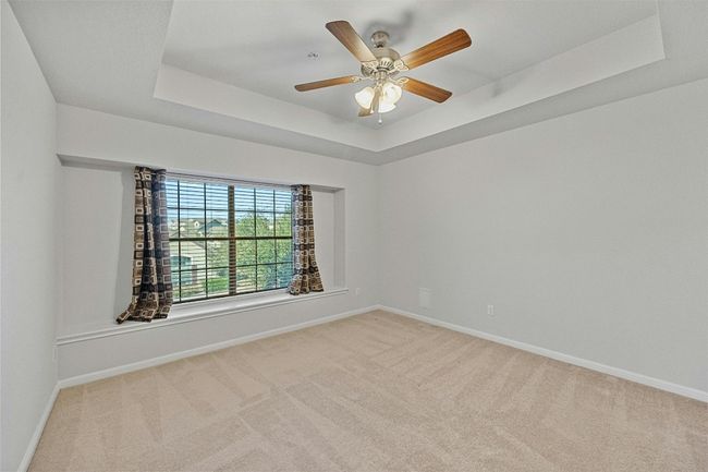Spacious second bedroom upstairs with coffered ceiling | Image 19