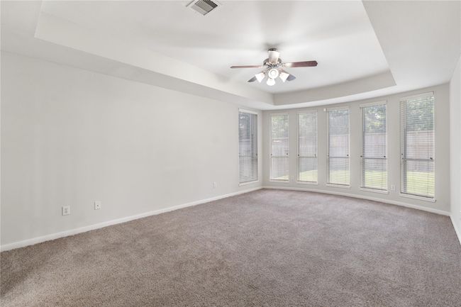 Alternative view of primary bedroom without staging. | Image 37