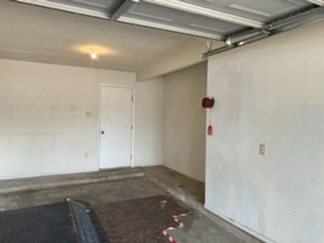 1 car garage with storage space. | Image 13