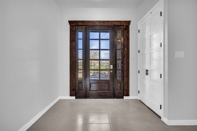Entryway featuring light tile patterned flooring | Image 7