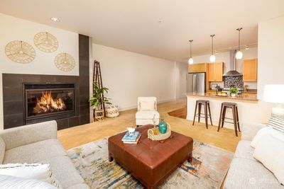 Looking back towards the living room and kitchen area from the deck windows. Sellers had tv mounted above the fireplace, so yes, it's an option. | Image 3