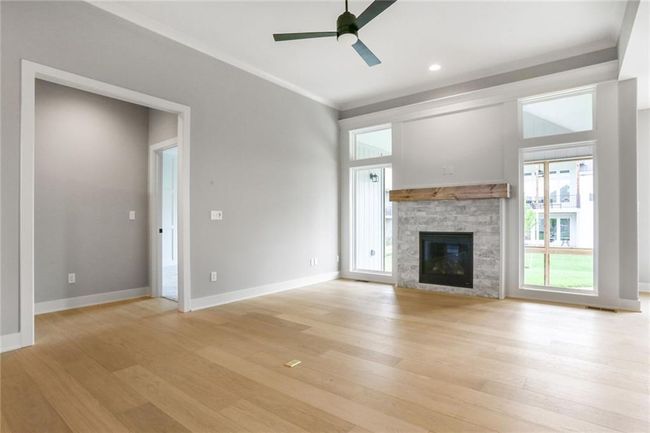 Fireplace framed w Large Windows | Image 6