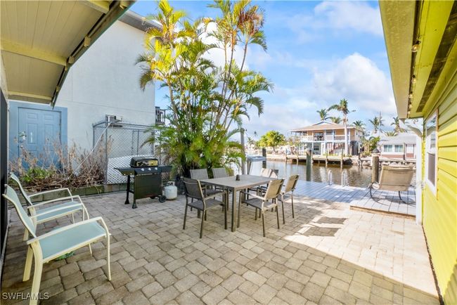 View of patio featuring a boat dock and a water view | Image 43