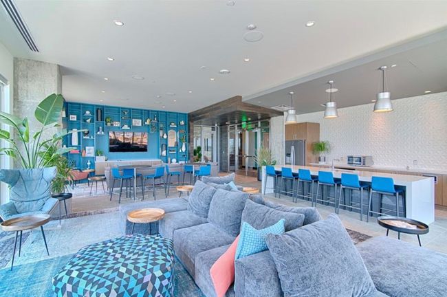 Living room with recessed lighting and light tile patterned flooring | Image 26
