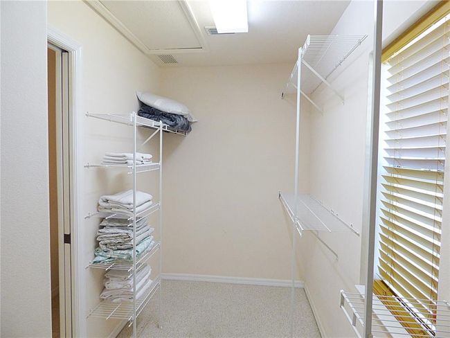 the dressing room has an access to the attic | Image 47