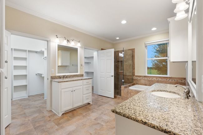 Full bathroom with a shower stall, a sink, ornamental molding, and recessed lighting | Image 16