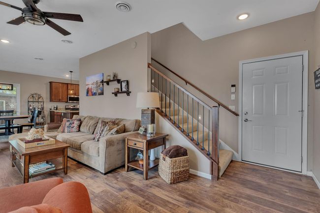 Luxury Vinyl Plank flooring throughout the mail level, ideal for lakeside living. Attached 2 stall garage access | Image 15
