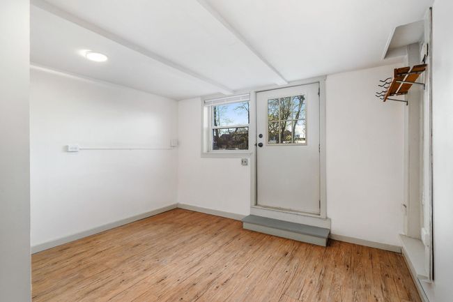 Additional lower level space with door to parking lot. | Image 19