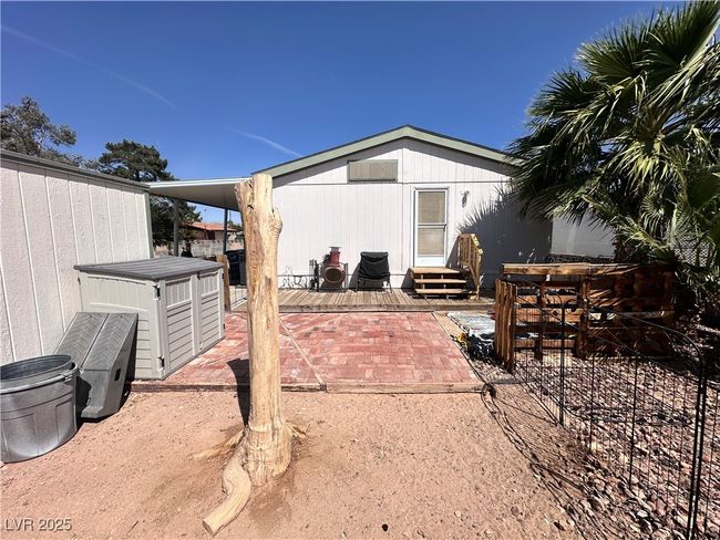 Rear view of property featuring entry steps and a patio | Image 20