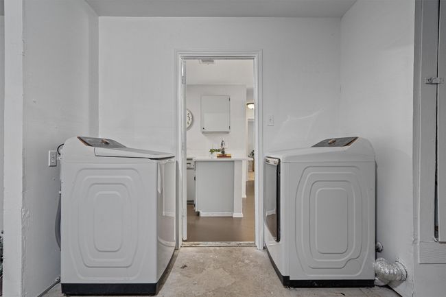 Laundry area with washer and dryer | Image 21