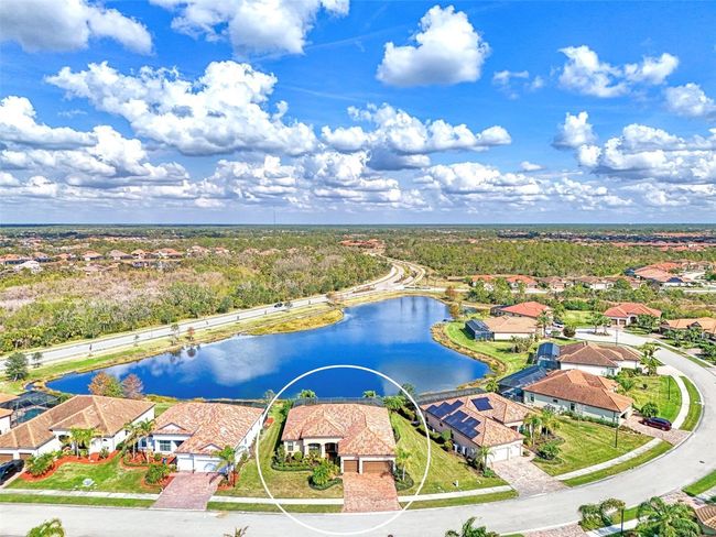 Circled Aerial View of House on Lake | Image 6