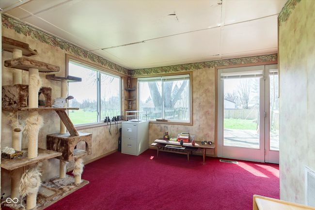 sunroom / solarium with carpet flooring and visible vents | Image 6