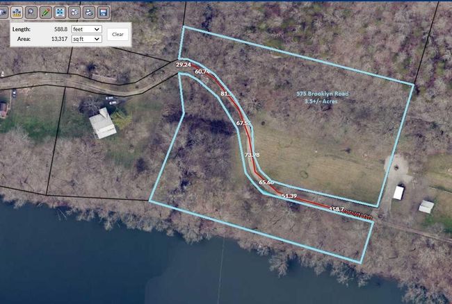 The subject property is approximately 3.5+/- acres and is on both side of the Brooklyn Road that runs through it. The Kentucky river is on the southern border and the northern border | Image 5