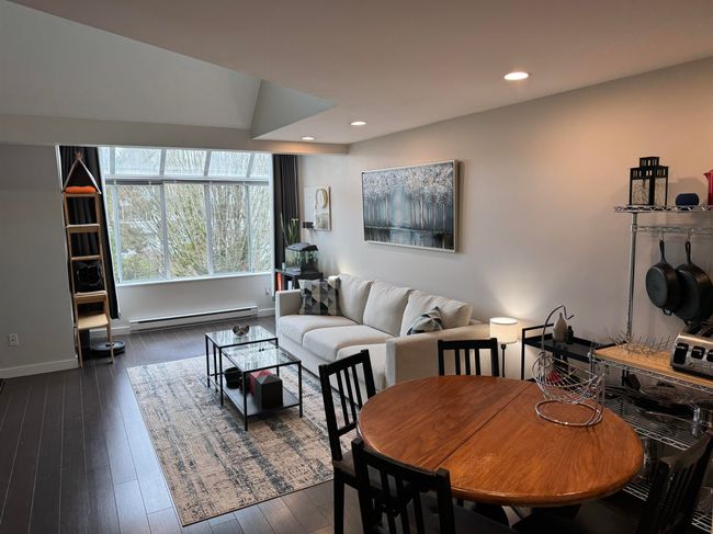 Dining room with dark wood-style flooring, recessed lighting, baseboards, and a baseboard radiator | Image 7