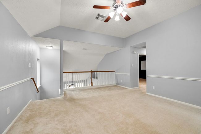 The loft-style layout keeps things feeling open while still offering a defined space for games, work, or creative setups. | Image 27