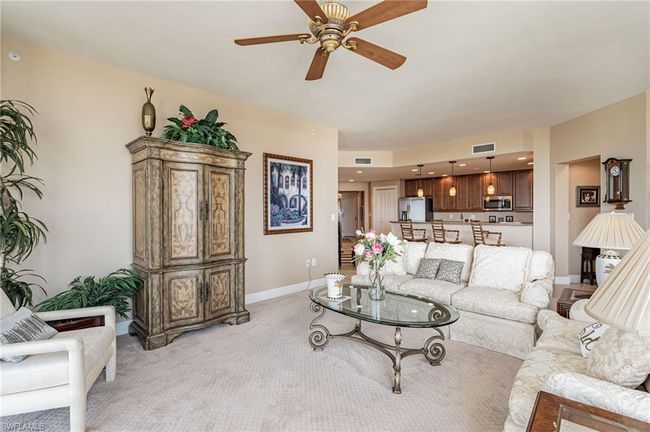 Carpeted living room featuring ceiling fan | Image 16