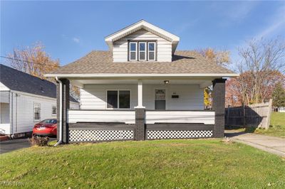 View of front of house with a front yard and covered porch | Image 1