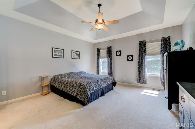 On your way out of the closet, notice the coffered ceiling, the ceiling fan and two windows for bringing in the natural light. | Image 23