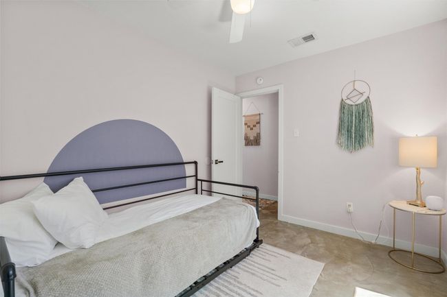Bedroom with a ceiling fan and baseboards | Image 22