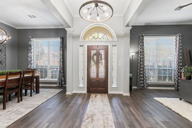 Guest will be greeted in a breathtaking one story foyer that is accented with extensive wood look tile floors, and rising ceilings. | Image 8